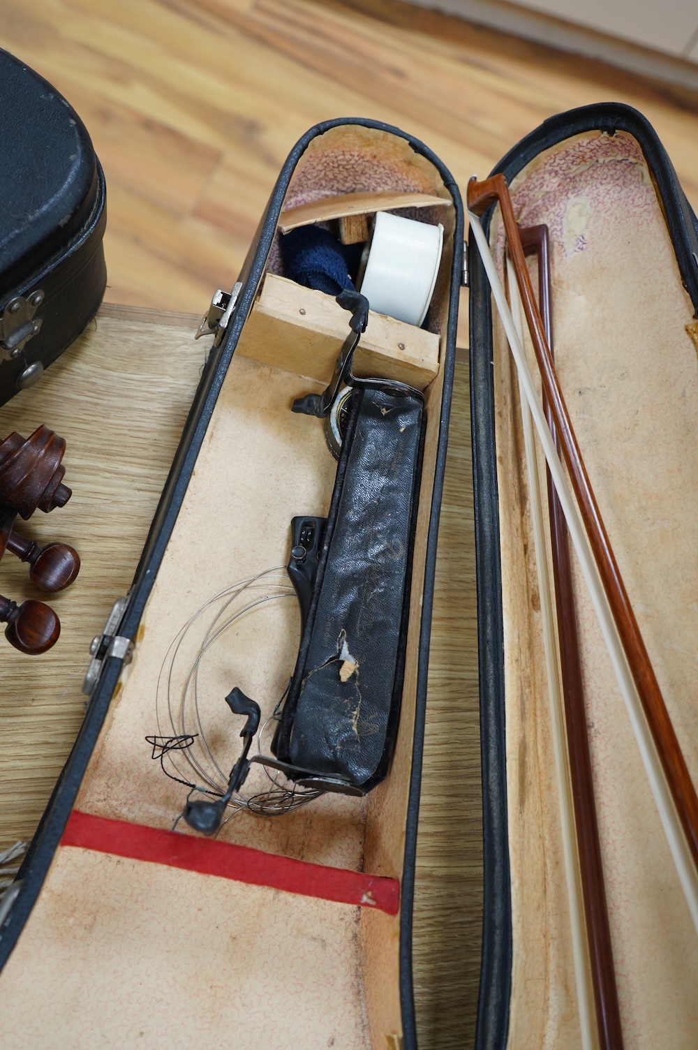 An early 20th century cased Welsh violin, the handwritten label inside the body reads; ‘James Parkinson, Llandudno No.9, 1921’, with a single piece back, inlaid stringing to the edge of the body, length of body 35.5cm, t